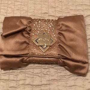 Maroon metallic BCBG clutch
